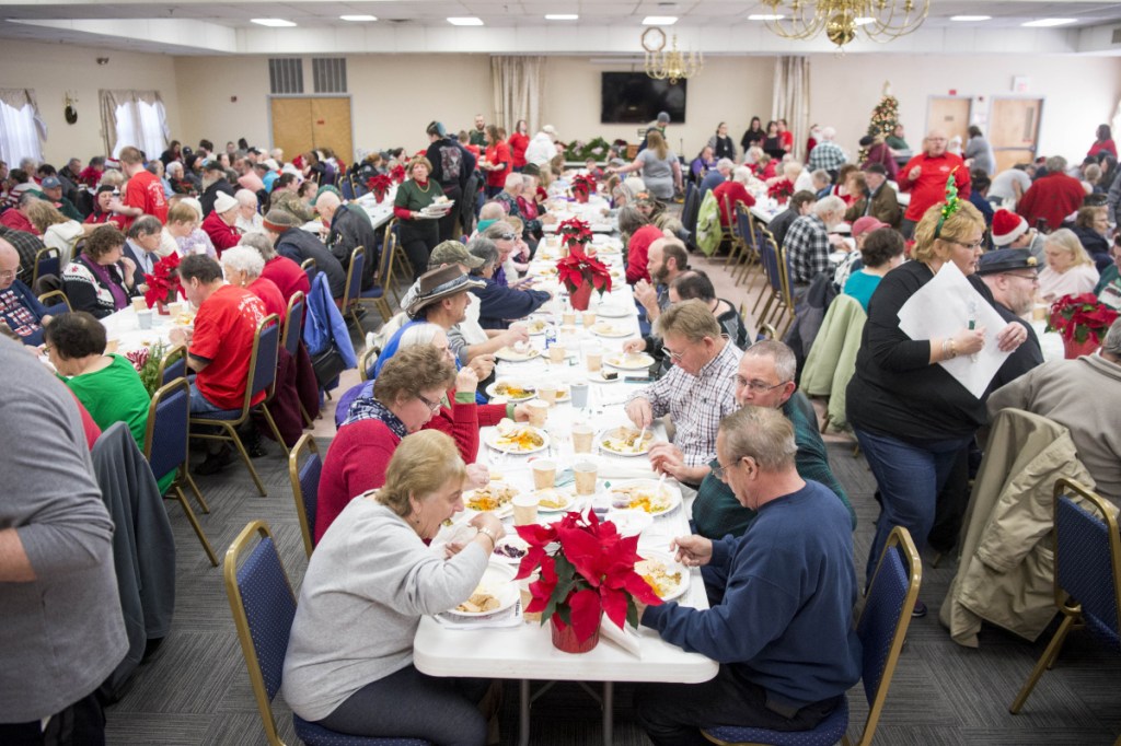 The tables were filled at the 12th annual Central Maine Family Christmas Dinner at the Elk's Lodge in Waterville on Tuesday. Nearly one thousand meals were prepared.