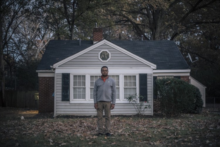 Christopher Neely stands in front of the house he had rented from FirstKey in Memphis.