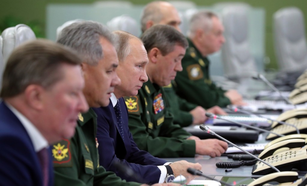 Russian President Vladimir Putin, third from left, observes Wednesday's test launch of the Avangard hypersonic glide vehicle from the Defense Ministry's control room in Moscow. The weapon is said to be impossible to intercept.