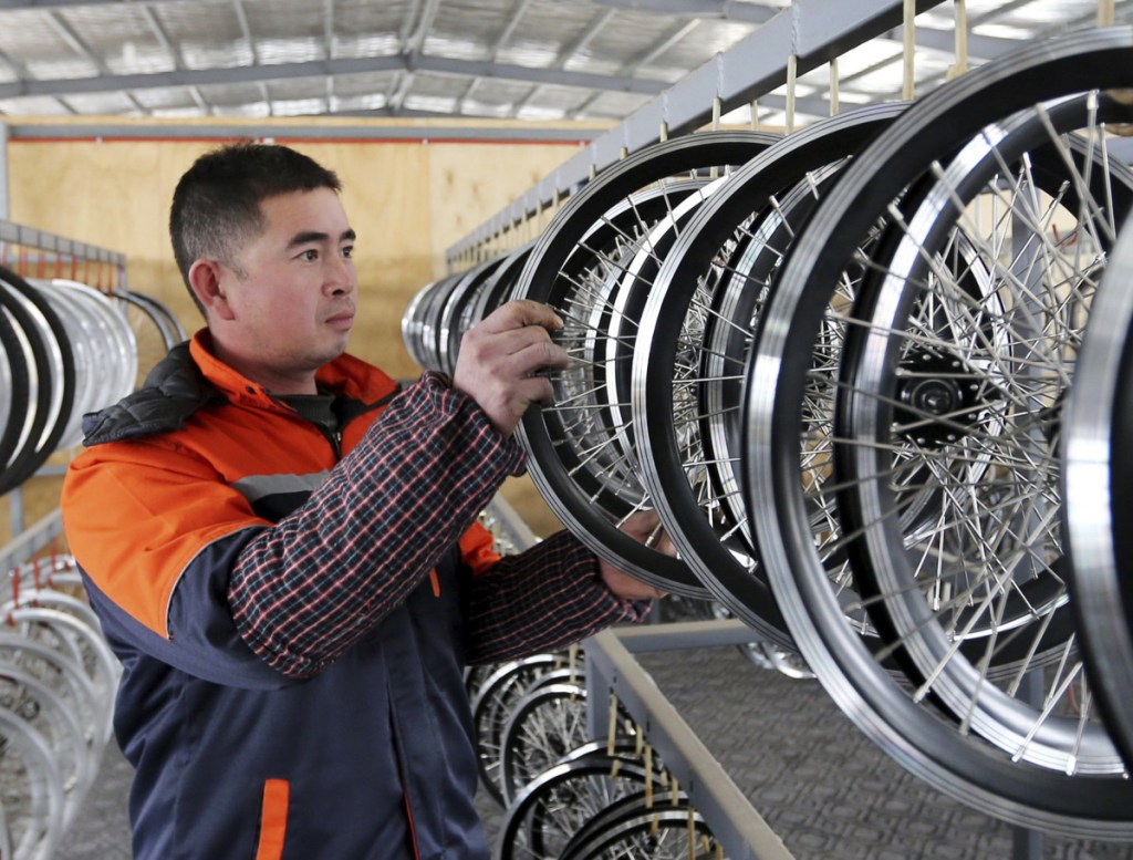 An employee works at a factory producing electronic bicycles for export in Huaibei. Both the U.S. and China have said they want to resolve trade differences, but progress has been slow.