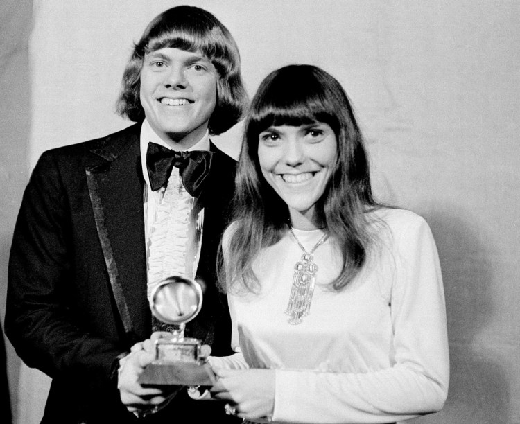 In this March 17, 1971 file photo, Richard and Karen Carpenters of The Carpenters pose with their Grammy during the 13th annual 1970 Grammy Awards in Los Angeles. The brother-sister duo was named best new artist of the year, 1970, and also won as the best contemporary duo or group vocalists for "Close to You."  