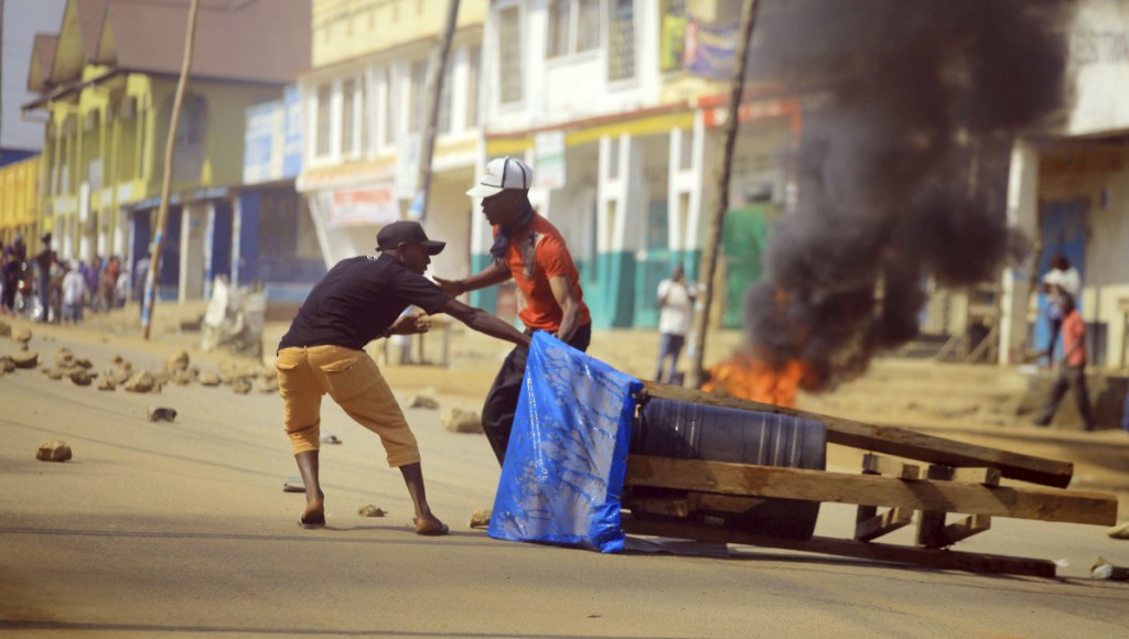 Protesters set up a barricade in the eastern Congolese town of Beni on Thursday. Police fired live ammunition and tear gas to disperse dozens of people protesting a presidential election delay.