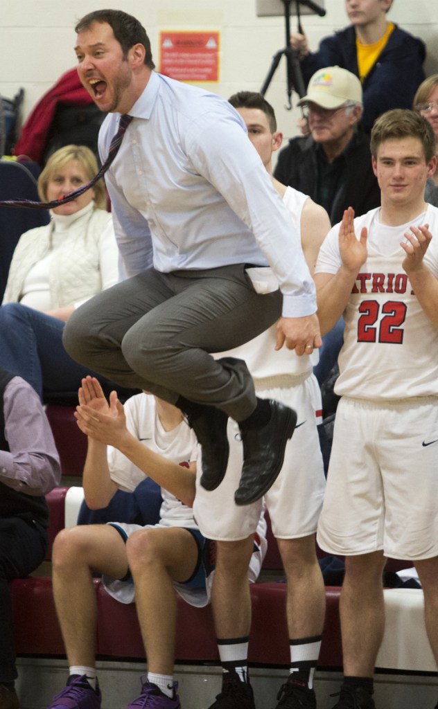 Gray-New Gloucester Coach Ryan Deschenes shows his excitement Friday night following Jonathan Martin's basket off a rebound during the 58-52 win over Yarmouth in Gray.