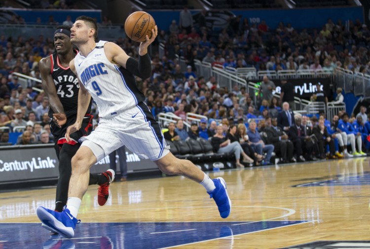 Nikola Vucevic, who finished with 30 points and 20 rebounds for the Orlando Magic, drives against Pascal Siakam of the Toronto Raptors in the second half of Orlando's 116-87 victory at home Friday night.