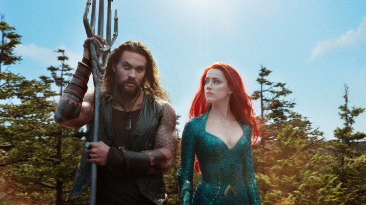 Jason Momoa and Amber Heard star in "Aquaman," which added $51.6 million in North American ticket sales over the weekend to take first place again.
