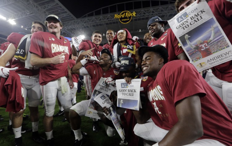 The Alabama team poses at the end of the Orange Bowl on Saturday in Miami Gardens, Fla. Alabama beat Oklahoma 45-34 to reach the title game.
