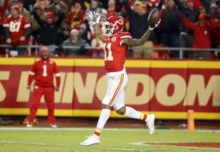 Demarcus Robinson of the Kansas City Chiefs runs backwards into the end zone after catching an 89-yard pass from Patrick Mahomes.