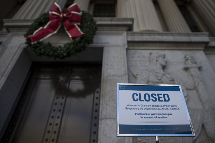 A sign announcing the closure of the National Archives because of the partial government shutdown is displayed in Washington, D.C.