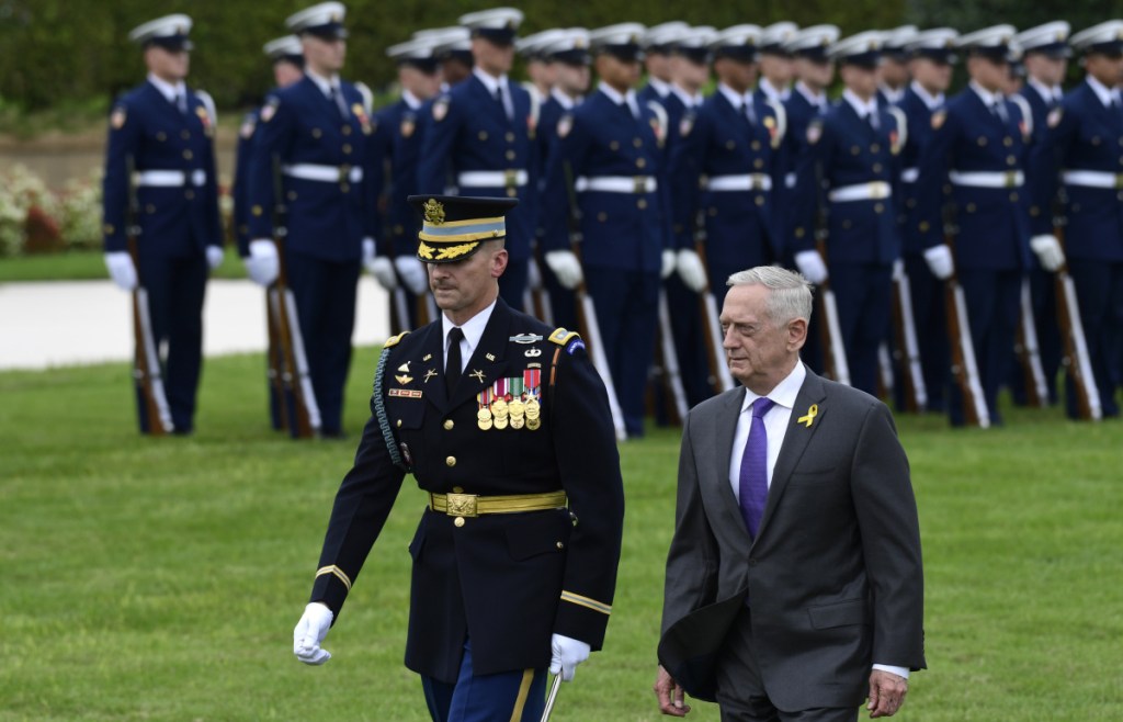Defense Secretary Jim Mattis reviews the troops during the 2018 POW/MIA National Recognition Day Ceremony at the Pentagon on Sept. 21. Quoting President Abraham Lincoln, Mattis issued a farewell message Monday to employees of the Defense Department, urging them to stay focused on their mission.
