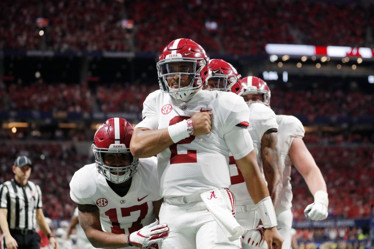 Alabama quarterback Jalen Hurts (2) celebrates his touchdown against Georgia during the second half of the Southeastern Conference championship  Saturday in Atlanta. 