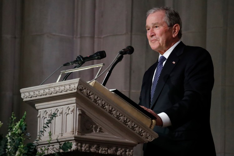 Former President George W. Bush pauses as speaks at the State Funeral for his father, former President George H.W. Bush, at the National Cathedral, Wednesday, Dec. 5, 2018, in Washington.