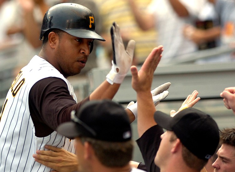 Pittsburgh Pirates' Jose Castillo is greeted in the dugout by teammates after hitting a game-tying solo home run in the bottom of the ninth off San Francisco Giants closer Armando Benitez during a baseball game in Pittsburgh. Former Major League Baseball players Luis Valbuena and Jose Castillo have been killed in a car crash in Venezuela. MLB tweeted late Thursday, Dec. 6, 2018, the 33-year-old Valbuena and 37-year-old Castillo died. Both were playing for Cardenales de Lara in the Venezuelan league.