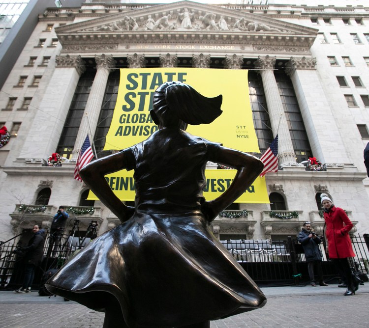 The Fearless Girl statue is unveiled at its new location in front of the New York Stock Exchange, Monday, Dec. 10, 2018, in New York. The statue, considered by many to symbolize female empowerment, was previously located near the Charging Bull statue on lower Broadway. 