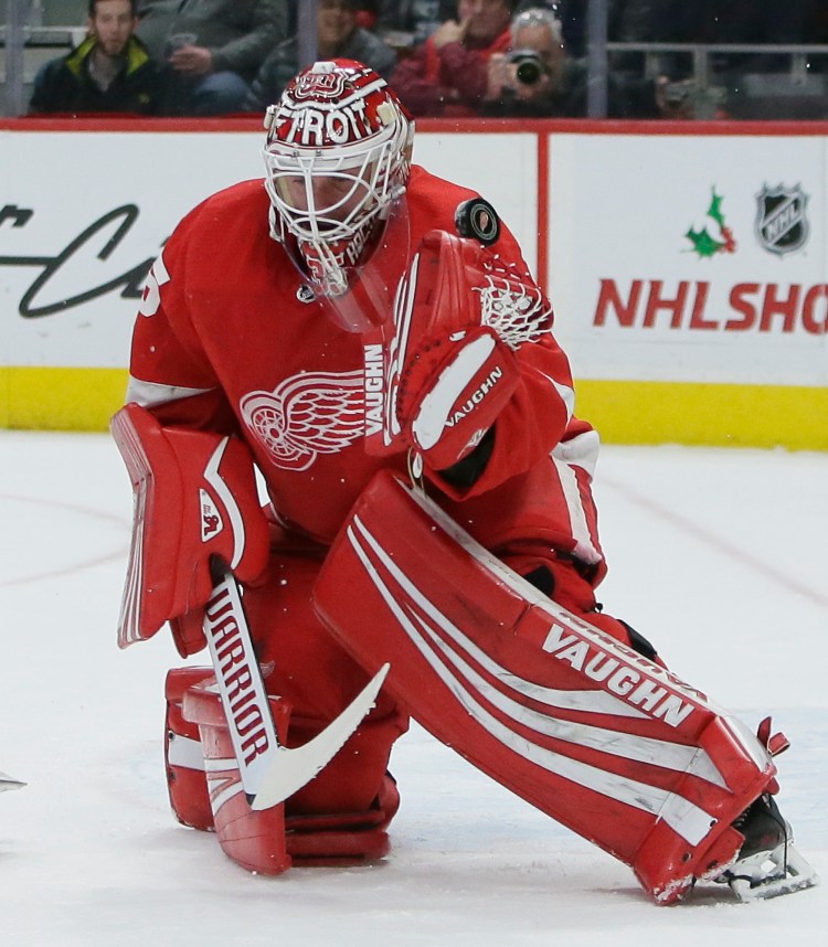 A shot deflects off the shoulder of Detroit Red Wings goaltender Jimmy Howard (35) during the first period of the Red Wings 3-1 win over the Kinds on Monday in Detroit. 