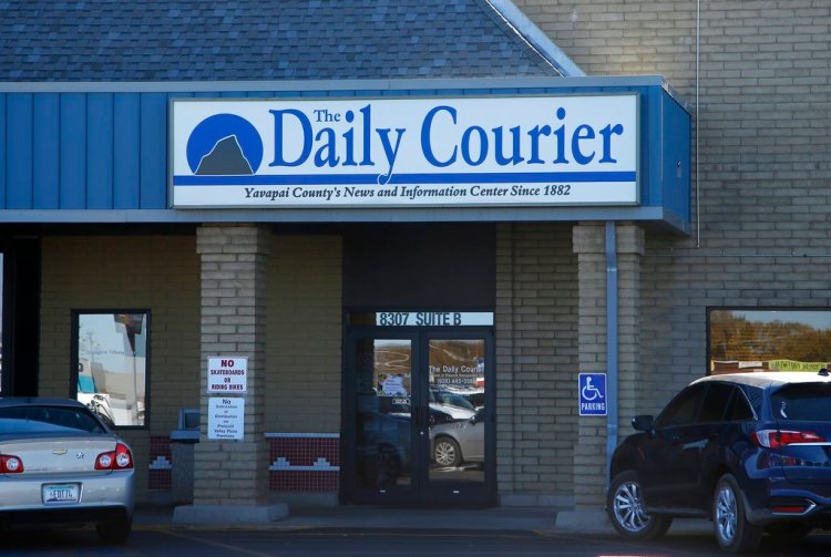 This Nov. 19, 2018, photo shows an entrance of the Prescott Daily Courier, owned by Joseph Soldwedel, in Prescott, Ariz. Soldwedel and his wife Felice Soldwedel are locked in a bizarre divorce dispute that includes allegations of poisoning. (AP Photo/Ross D. Franklin)