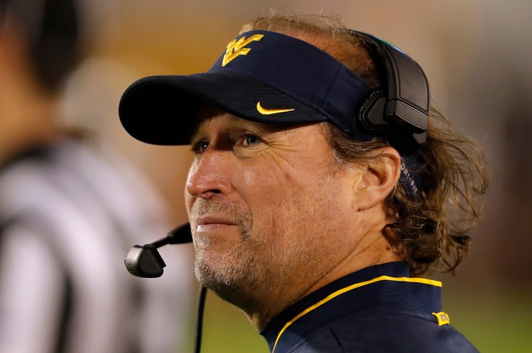 West Virginia head coach Dana Holgorsen can earn a $50,000 bonus if West Virginia beats Syracuse next week in the Camping World Bowl, a game the Mountaineers will play without star quarterback Will Grier and left tackle Yodny Cajuste.