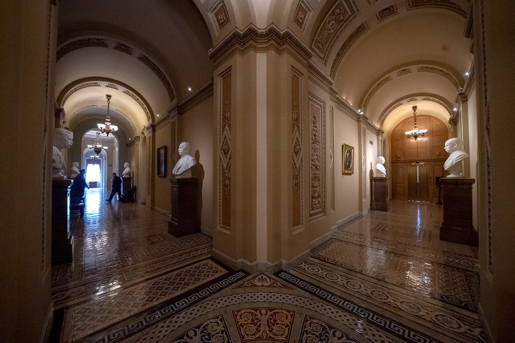 Empty corridors around the Senate are seen at the Capitol in Washington, Thursday, Dec. 27, 2018, during a partial government shutdown. Chances look slim for ending the partial government shutdown any time soon. Lawmakers are away from Washington for the holidays and have been told they will get 24 hours' notice before having to return for a vote.  (AP Photo/J. Scott Applewhite)