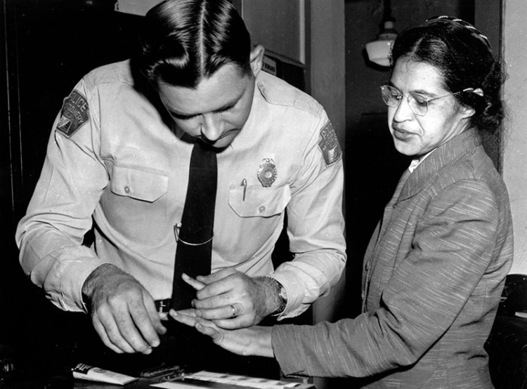 Rosa Parks is fingerprinted by police Lt. D.H. Lackey in Montgomery, Ala., Feb. 22, 1956, two months after refusing to give up her seat on a bus for a white passenger on Dec. 1, 1955.  