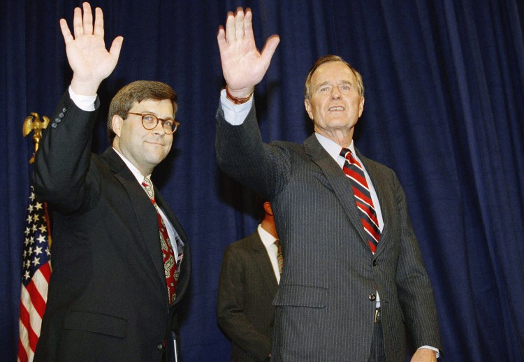 William Barr is shown with then-President George H.W. Bush after Barr was sworn in as U.S. attorney general on Nov. 26, 1991, at a Justice Department ceremony in Washington. Barr is said to be the Trump administration's top candidate for his old job.