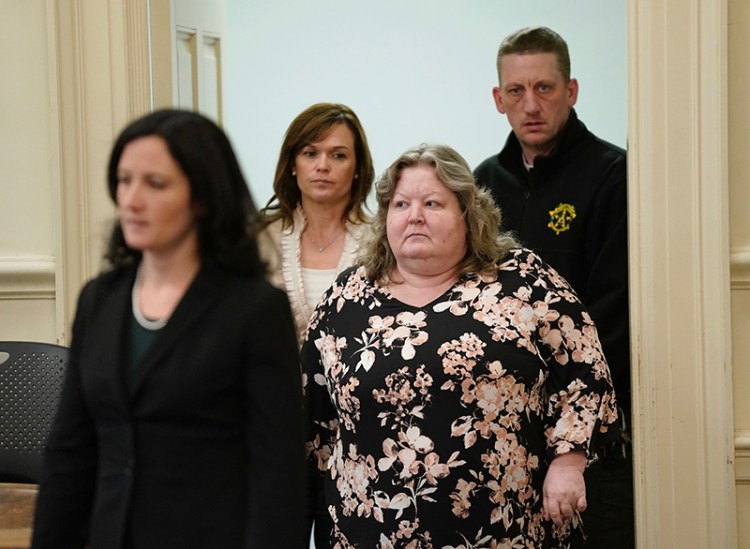 Kandee Collind, right, enters York County Superior Court in Alfred on Thursday with her attorneys Molly Butler Bailey, left, and Heather Gonzales. The receipt of new evidence in the case led the judge to continue the hearing until January.