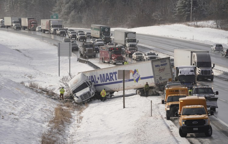 Traffic backs up as it is routed around a jackknifed tractor-trailer truck in the northbound lane of the Maine Turnpike in Biddeford on Jan. 3. Sagadahoc County Sheriff Joel Merry sees the danger in allowing much heavier single-trailer trucks and even longer trailers on their double-trailer trucks.