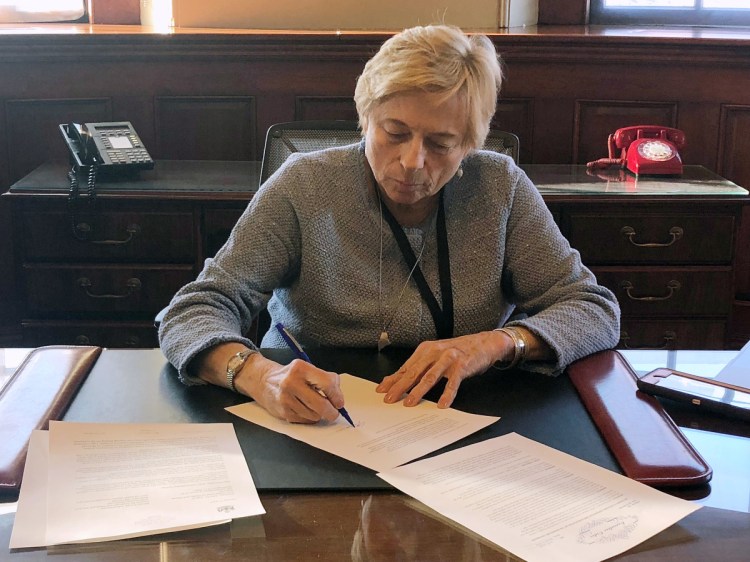 Gov. Janet Mills signs "Executive Order 1" to implement Medicaid expansion on her first day in office, making more than 70,000 Mainers eligible for health insurance.