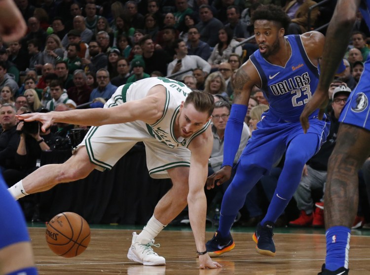 Celtics forward Gordon Hayward loses control of the ball while being defended by Mavericks guard Wesley Matthews during the Celtics' 114-93 win Friday in Boston. Hayward had 16 points, 11 rebounds and eight assists.