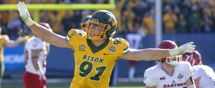 North Dakota State defensive end Derrek Tuszka waves his arms like an eagle – Eastern Washington's mascot – after sacking quarterback Eric Barriere in the final minutes of a 38-24 victory in the FCS championship game Saturday at Frisco, Texas.
