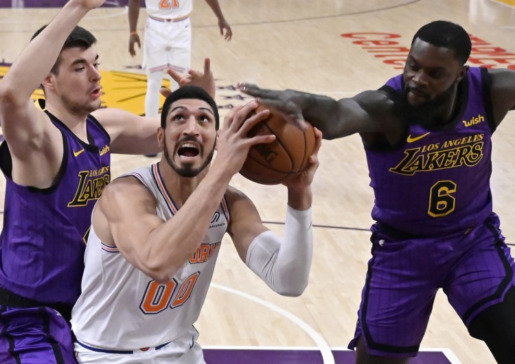 Knicks center Enes Kanter, center, will not travel to London for New York's game against Washington because he fears he could be killed because of his opposition of Turkish President Tayypi Erdogan.
