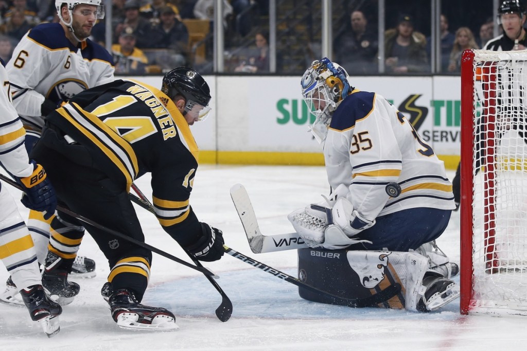 Sabres goalie Linus Ullmark blocks a shot by Boston's Chris Wagner, who scored the Bruins' first goal in a 2-1 victory.