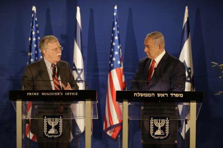 National Security Adviser John Bolton, left, speaks to Israeli Prime Minister Benjamin Netanyahu after their meeting in Jerusalem on Sunday.