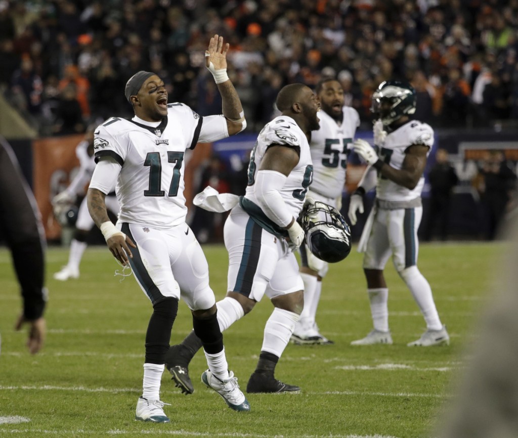 Alshon Jeffery, left, and his Eagles teammates celebrate after a potential winning field goal by Bears kicker Cody Parkey clanged off both the left upright and the crossbar.