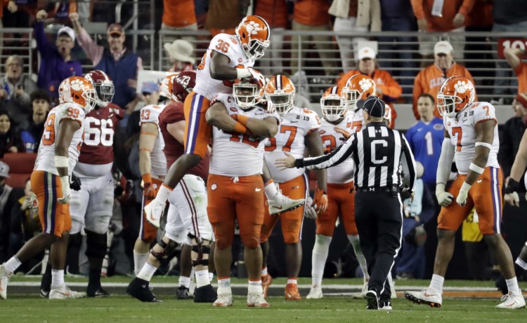 The Clemson defense celebrates after stopping Alabama during the second half of the Tigers' 44-16 win in the College Football Playoff national championship game on Monday in Santa Clara, California.