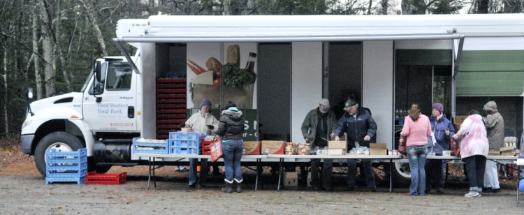 Volunteers distribute food at a mobile pantry in Jefferson. A promo for the Food section saying "Hope you're hungry" was insensitive, a reader says.