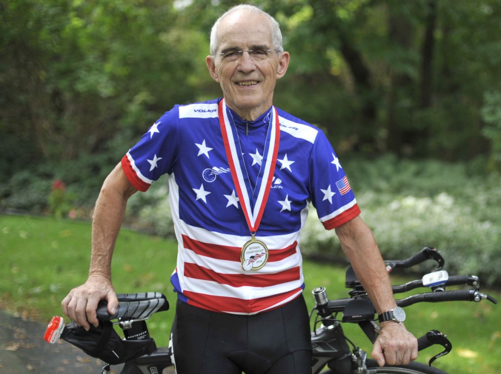 Carl Grove, seen here outside his Indiana home in 2010, has racked up 18 national titles while setting age-group cycling records.