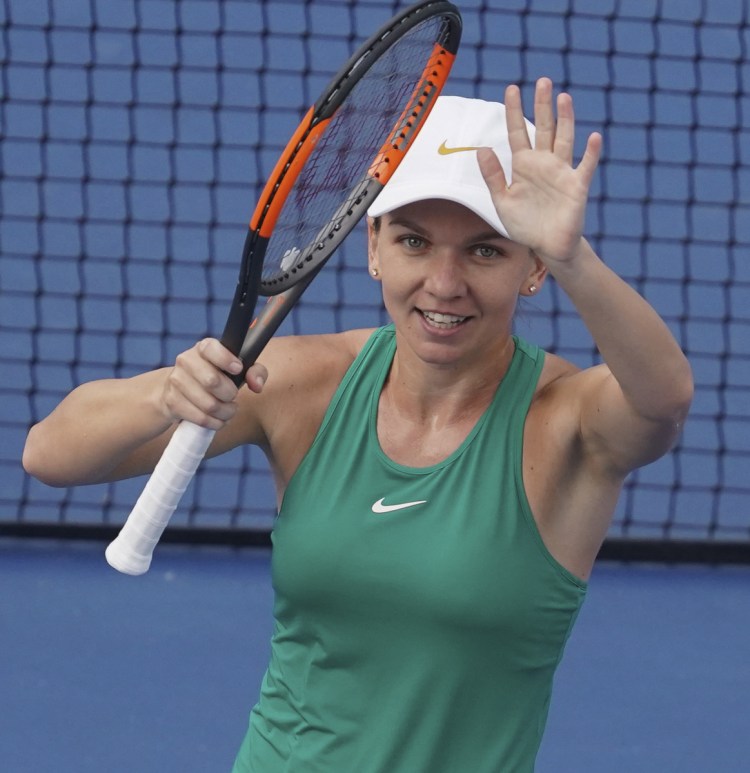 Simona Halep, of Romania, acknowledges the crowd after defeating Aryna Sabalenka, of Belarus, during the semifinals at the Western & Southern Open tennis tournament, Saturday, Aug. 18, 2018, in Mason, Ohio. (AP Photo/John Minchillo)