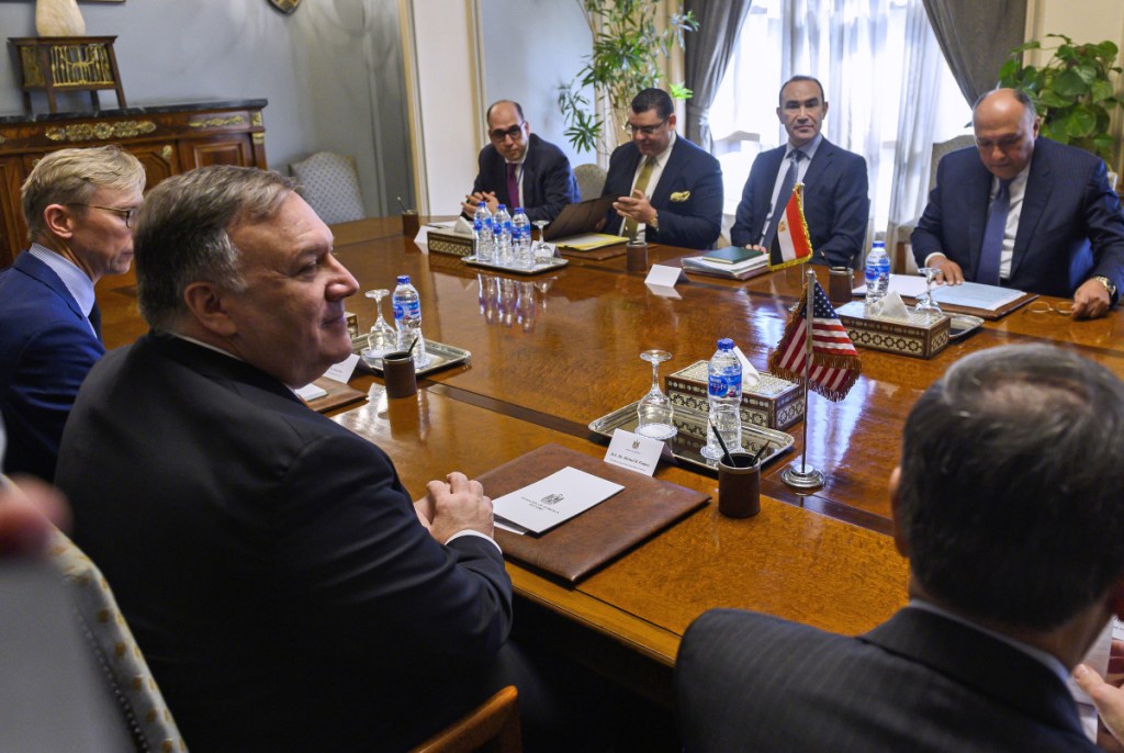 U.S. Secretary of State Mike Pompeo, second from left, meets with Egyptian Foreign Minister Sameh Shoukry, second from right, and the delegation in Cairo before his speech at American University.