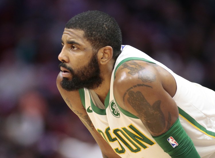 Associated Press/Joel Auerbach Boston Celtics guard Kyrie Irving looks on during the first half of Thursday's game in Miami.