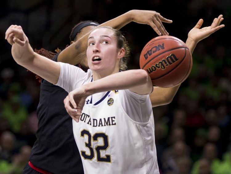 Jessica Shepard of Notre Dame has the ball knocked away by Bionca Dunham of Louisville the first half of Notre Dame's 82-68 victory Thursday night.
