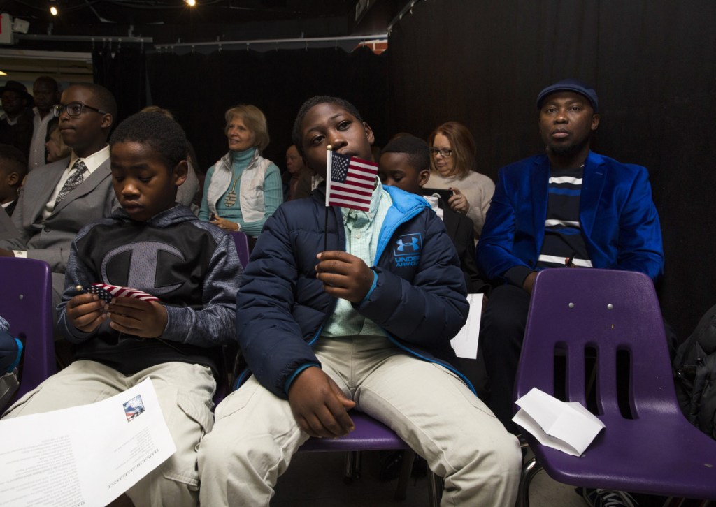 Mortada Abdalla, 9, right, and his brother Maaz Abdalla, 7, after taking the Oath of Allegiance. The boys, originally from Sudan, were two of four siblings who became citizens.