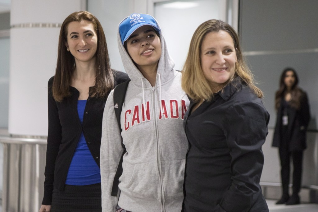 Rahaf Mohammed Alqunun, 18, center, stands with Canadian Minister of Foreign Affairs Chrystia Freeland, right, as she arrives in Toronto on Saturday. Other countries were in talks to provide refuge but the Saudi teen chose Canada.