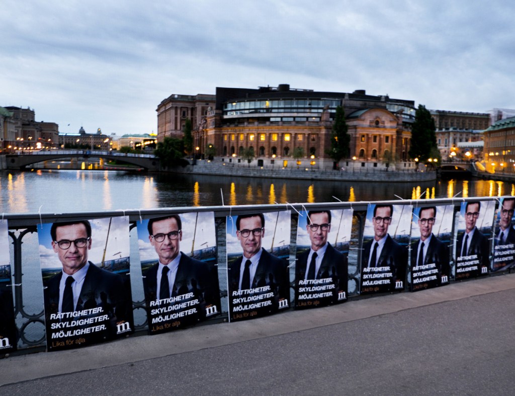Election posters of the Moderate Party's Ulf Kristersson line a bridge in front of the Swedish parliament in Stockholm, Sweden, last year. High taxes are generally accepted in Sweden and other Nordic countries, where state benefits are more generous than in the United States.