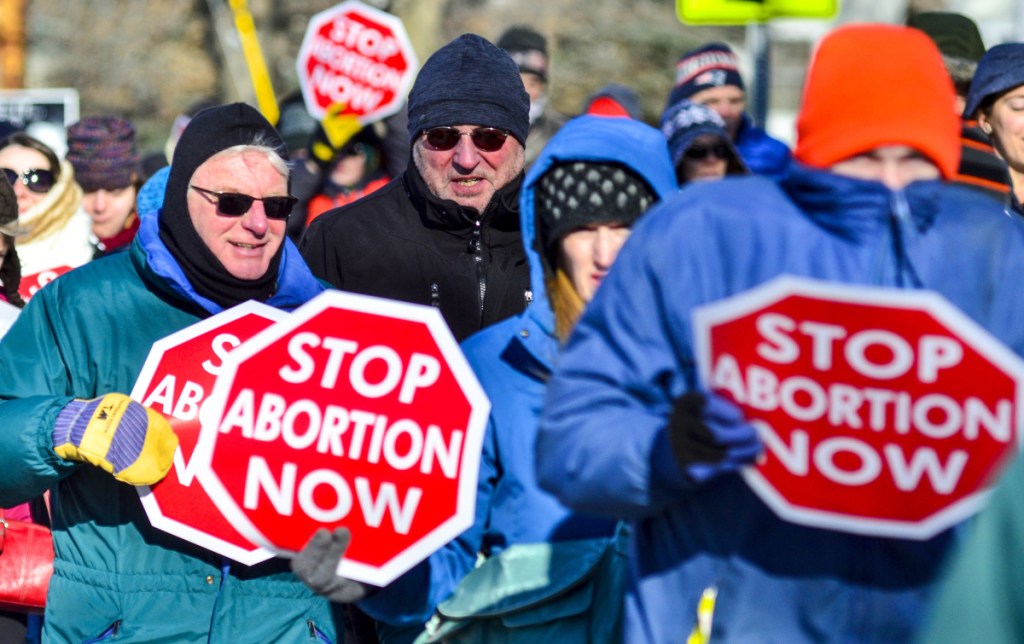 The annual Hands Around the Capitol demonstration brought together abortion critics, who face an uphill climb now that Democrats control the Legislature and Blaine House.