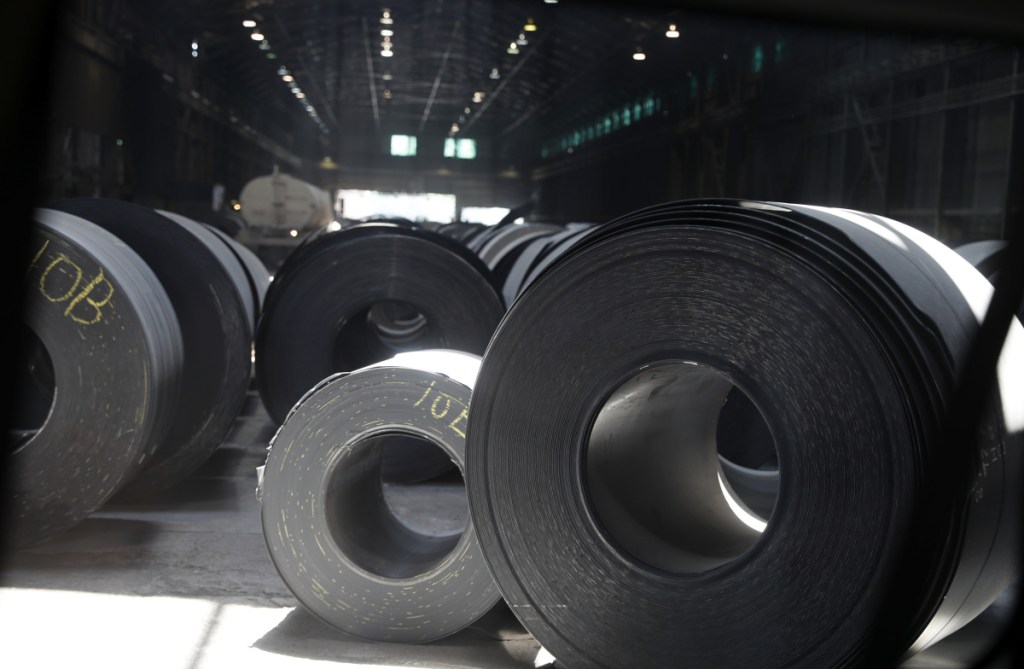 Rolls of finished steel sit on the floor of a facility in Granite City, Ill. President Trump's steel tariffs have raised metals prices in the United States, putting financial pressure on manufacturers who use steel in their production process.