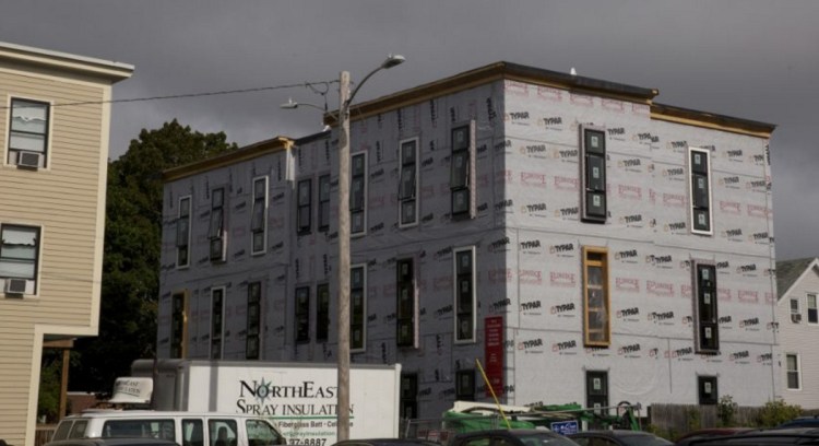The Onejoy project, a 12-unit condo building under construction in Portland's West End last fall. A unit in the development is being set aside as affordable housing for a middle-income family.