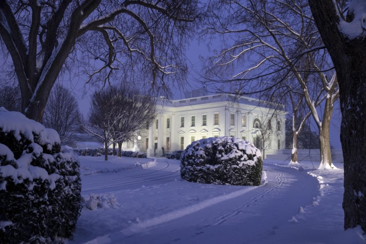 The White House is seen as snow continues to fall Sunday in Washington. (AP Photo/Alex Brandon)
