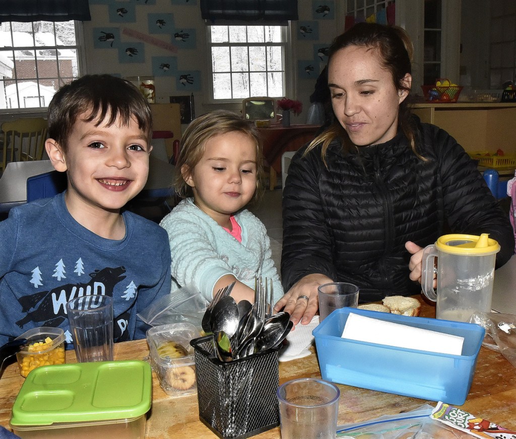 Lindsay Bragdon sits for lunch with her daughter Jaynee along with her buddy Adrien on Thursday at the Children's Place at the Maine Children's Home for Little Wanderers in Waterville.