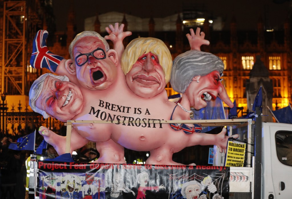 An anti-Brexit effigy is driven around Parliament square in London on Tuesday after the House of Commons rejected the Brexit deal struck between Britain's government and the EU in November.