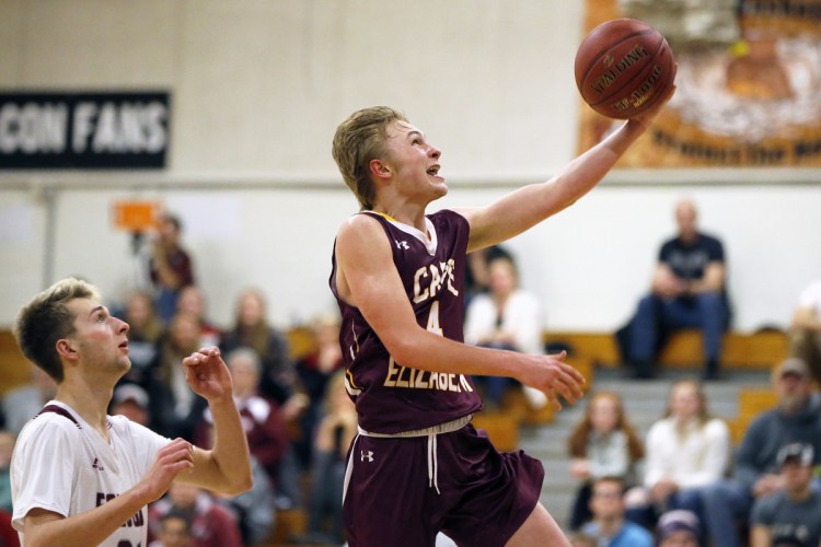Cape Elizabeth's Quinn Morse shoots a layup during the Capers' 46-43 win Tuesday at Freeport. The Capers rallied from a 15-point deficit to improve to 6-6.