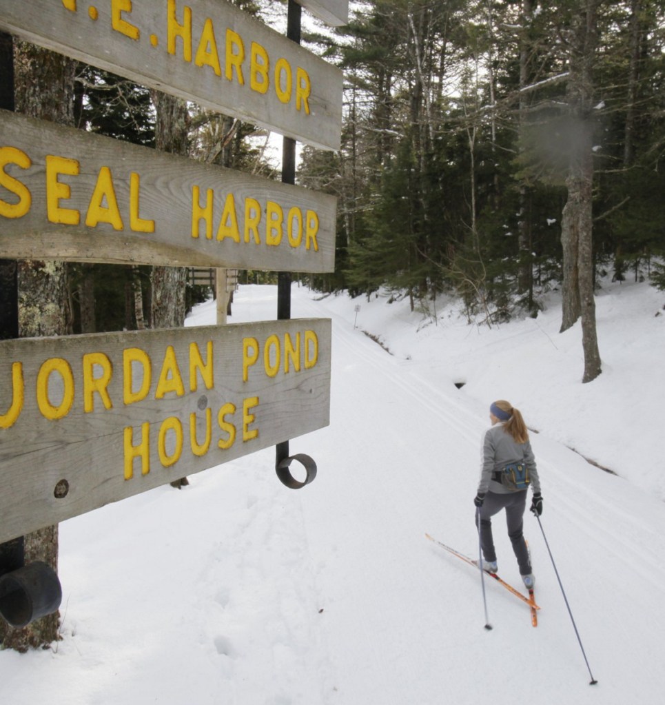 Abigail Curliss of Southwest Harbor skis beside Eagle Lake on a carriage road at Acadia National Park on Mount Desert Island. Curliss has worked as a volunteer trail groomer.